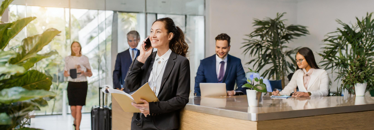 Office reception area with lady standing by reception desk at trademark law office