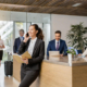 Office reception area with lady standing by reception desk at trademark law office
