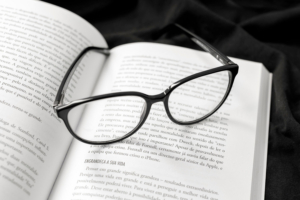 trademark text book with eyeglasses on top